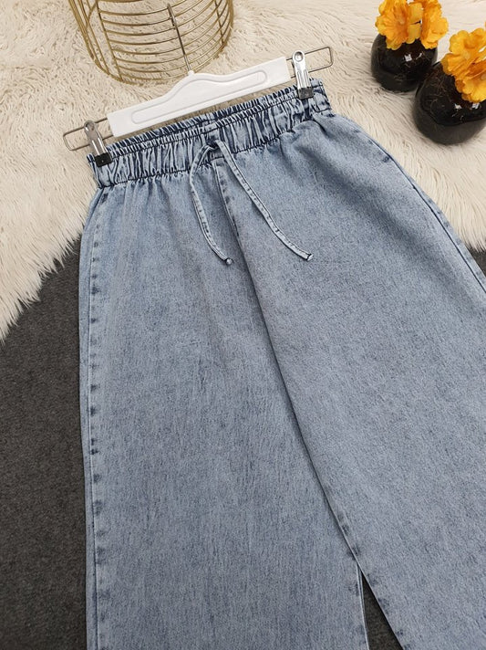 Bol Paça Beli Lastikli Bağcık Detaylı Kot Pantolon      -Buz Mavi